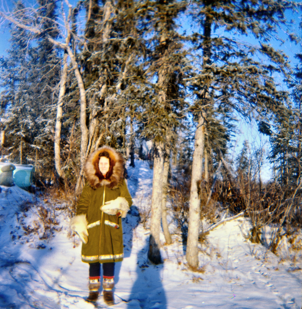1967? Lorene in parka mukluks and wolf head mittens near our house.