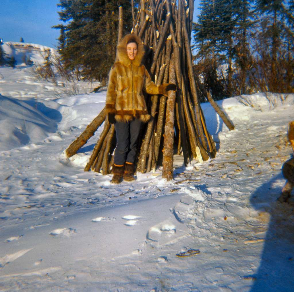 Late 1960s Dorene in her muskrat parka and caribou skin, oogruk bottom mukluks.