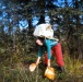 1969 Dorene picking blueberries. Birch bark basket Dorene made, spruce root calutuk made by Oliver, pack made by Dorene.