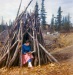 Late 1960s Dorene studying in woodpile.