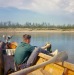 Late-1960s-Gerald-in-our-boat.-Very-small-outboard-engine.-Perhaps-3-HP-tif