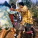 Late 1960s Playing at a birthday party with baloons.