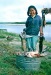Mabel Cleveland with a mid-summer catch of Chum Salmon. Ambler, Alaska, 1964