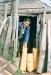 Mamie Cleveland with gathered birch bark for basket making.  Ambler, Alaska 1964.