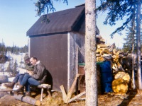 122-Boys-study-against-warm-wall-of-outhouse1968