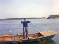 Gerald checking white fish net.
