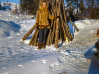 Late 1960s Dorene in her muskrat parka and caribou skin, oogruk bottom mukluks.
