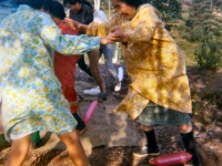 Late 1960s Playing at a birthday party with baloons.