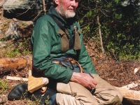 Oliver kneeling, Norway, raft building, Oliver in Norway